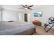 Brightly lit bedroom featuring a large bed, TV, and exercise equipment at 20916 E Via De Arboles --, Queen Creek, AZ 85142