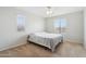 A simply furnished bedroom with carpet, ceiling fan, and window at 20916 E Via De Arboles --, Queen Creek, AZ 85142