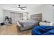 Bedroom featuring a large bed, bedside table, and window with blinds at 20916 E Via De Arboles --, Queen Creek, AZ 85142