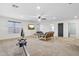 Large bonus room with carpeting, a ceiling fan, and abundant natural light at 20916 E Via De Arboles --, Queen Creek, AZ 85142