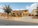 Charming two-story home featuring a stone facade, two-car garage, and well-maintained landscaping at 20916 E Via De Arboles --, Queen Creek, AZ 85142