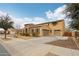 Charming two-story home featuring a stone facade, two-car garage, and well-maintained landscaping at 20916 E Via De Arboles --, Queen Creek, AZ 85142