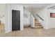 Foyer area featuring tile flooring, a dark interior door, and carpeted stairs at 20916 E Via De Arboles --, Queen Creek, AZ 85142