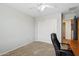 Home office featuring wall to wall carpet, a ceiling fan, and closet at 20916 E Via De Arboles --, Queen Creek, AZ 85142