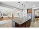 Open-concept kitchen with granite countertops, stainless steel appliances, and a refrigerator at 20916 E Via De Arboles --, Queen Creek, AZ 85142