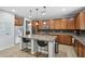 Charming kitchen with a granite island, stainless steel appliances, and a built-in microwave at 20916 E Via De Arboles --, Queen Creek, AZ 85142