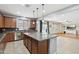 Modern kitchen featuring granite countertops, stainless steel appliances, and hardwood cabinets at 20916 E Via De Arboles --, Queen Creek, AZ 85142