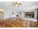 Spacious living room with hard wood flooring flowing into an open kitchen at 20916 E Via De Arboles --, Queen Creek, AZ 85142