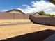 Spacious backyard with a block fence, offering privacy and potential for landscaping at 24578 W Grenadine Rd, Buckeye, AZ 85326