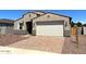 Charming single-story home with a two-car garage and desert landscaping at 24598 W Grenadine Rd, Buckeye, AZ 85326