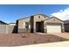 Charming single-story home with a two-car garage and desert landscaping at 24598 W Grenadine Rd, Buckeye, AZ 85326