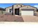 Charming single-story home with a two-car garage and desert landscaping at 24598 W Grenadine Rd, Buckeye, AZ 85326