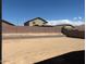 Empty backyard featuring perimeter block wall at 24612 W Grenadine Rd, Buckeye, AZ 85326