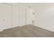 Bedroom with carpeted floor, white walls, and a closet with sliding doors at 24612 W Grenadine Rd, Buckeye, AZ 85326