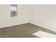 This bedroom has a carpeted floor, white walls and window with natural light at 24612 W Grenadine Rd, Buckeye, AZ 85326