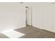 A bedroom with a carpeted floor, white walls, and a closet with sliding doors at 24612 W Grenadine Rd, Buckeye, AZ 85326