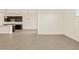 Open concept living room and kitchen with stainless steel appliances and granite countertops at 24612 W Grenadine Rd, Buckeye, AZ 85326