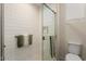 Modern shower features white subway tile surround and glass door in a well-lit bathroom at 26947 W Adam Ave, Buckeye, AZ 85396