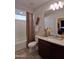 Cozy bathroom featuring a shower, a toilet, and a vanity sink with granite countertops at 26947 W Adam Ave, Buckeye, AZ 85396