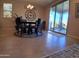 Dining room area with a modern chandelier and sliding glass doors that lead to the outdoor area at 26947 W Adam Ave, Buckeye, AZ 85396