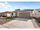 Charming single-story home featuring desert landscaping and a convenient two-car garage at 26947 W Adam Ave, Buckeye, AZ 85396