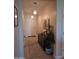 Inviting foyer with tile flooring, pendant lighting, and decorative console table at 26947 W Adam Ave, Buckeye, AZ 85396