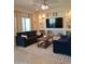 Cozy living room with comfortable seating, recessed lighting, and built-in display shelving at 26947 W Adam Ave, Buckeye, AZ 85396