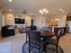 Bright, open-concept living space with built-in shelving, a dining area, and modern decor at 26947 W Adam Ave, Buckeye, AZ 85396