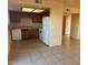 Efficient kitchen with white appliances, wood cabinets, and open layout at 2847 N 46Th Ave # 22, Phoenix, AZ 85035