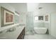 Bright bathroom featuring a luxurious soaking tub, walk-in shower, and modern vanity at 3140 E Claremont Ave, Phoenix, AZ 85016