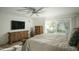 Spacious primary bedroom featuring a king bed, elegant furnishings, and sliding door access to outside at 3140 E Claremont Ave, Phoenix, AZ 85016