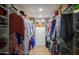 Spacious walk-in closet with ample shelving and hanging storage for clothes and accessories at 3140 E Claremont Ave, Phoenix, AZ 85016