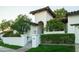 Exterior showcasing lush landscaping and a traditional Mediterranean architectural style at 3140 E Claremont Ave, Phoenix, AZ 85016
