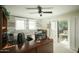 Bright home office with modern desk setup, neutral colors, and backyard access at 3140 E Claremont Ave, Phoenix, AZ 85016