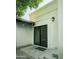 Outdoor patio area with tiled floors and a sliding glass door to the interior at 3140 E Claremont Ave, Phoenix, AZ 85016