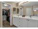 Bathroom featuring double sinks, a large mirror, and a walk-in closet at 3360 E Joseph Way, Gilbert, AZ 85295