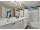 Bright bathroom featuring double sinks, a large mirror, and a shower-tub combination at 3360 E Joseph Way, Gilbert, AZ 85295