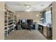 A cozy bedroom featuring carpeted floors, a ceiling fan, and ample shelving at 3360 E Joseph Way, Gilbert, AZ 85295