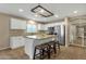 Bright kitchen featuring an island with granite countertops and stainless steel appliances at 3360 E Joseph Way, Gilbert, AZ 85295