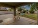 View of the covered patio, the swing set, and the spacious grassy yard at 3360 E Joseph Way, Gilbert, AZ 85295
