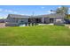 Spacious backyard with a lush lawn, sparkling pool, and covered patio, ideal for outdoor recreation and relaxation at 3401 N 34Th Pl, Phoenix, AZ 85018