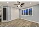 Empty bedroom with wood floor, closet, window shutters, crown molding, and ceiling fan with light at 3401 N 34Th Pl, Phoenix, AZ 85018