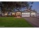 Charming single-Gathering home boasts an inviting entrance, a well-manicured front lawn and brick accents at 3401 N 34Th Pl, Phoenix, AZ 85018