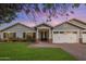 Charming single-Gathering home boasts an inviting entrance, a well-manicured front lawn and brick accents at 3401 N 34Th Pl, Phoenix, AZ 85018