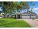Charming single-Gathering home boasts an inviting entrance, a well-manicured front lawn and brick accents at 3401 N 34Th Pl, Phoenix, AZ 85018
