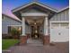 Charming home featuring a brick-paved entrance, a covered porch, and a well-manicured front yard at 3401 N 34Th Pl, Phoenix, AZ 85018