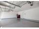 Spacious and clean garage with epoxy flooring, ample lighting, and a utility area with machines at 3401 N 34Th Pl, Phoenix, AZ 85018