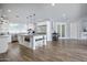 Bright, updated kitchen with large island, stainless appliances and wood-look tile floors at 3401 N 34Th Pl, Phoenix, AZ 85018