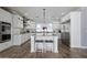 Bright kitchen with white cabinetry, stainless steel appliances, and a large marble island at 3401 N 34Th Pl, Phoenix, AZ 85018