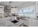 White kitchen with stainless steel appliances and marble countertops at 3401 N 34Th Pl, Phoenix, AZ 85018